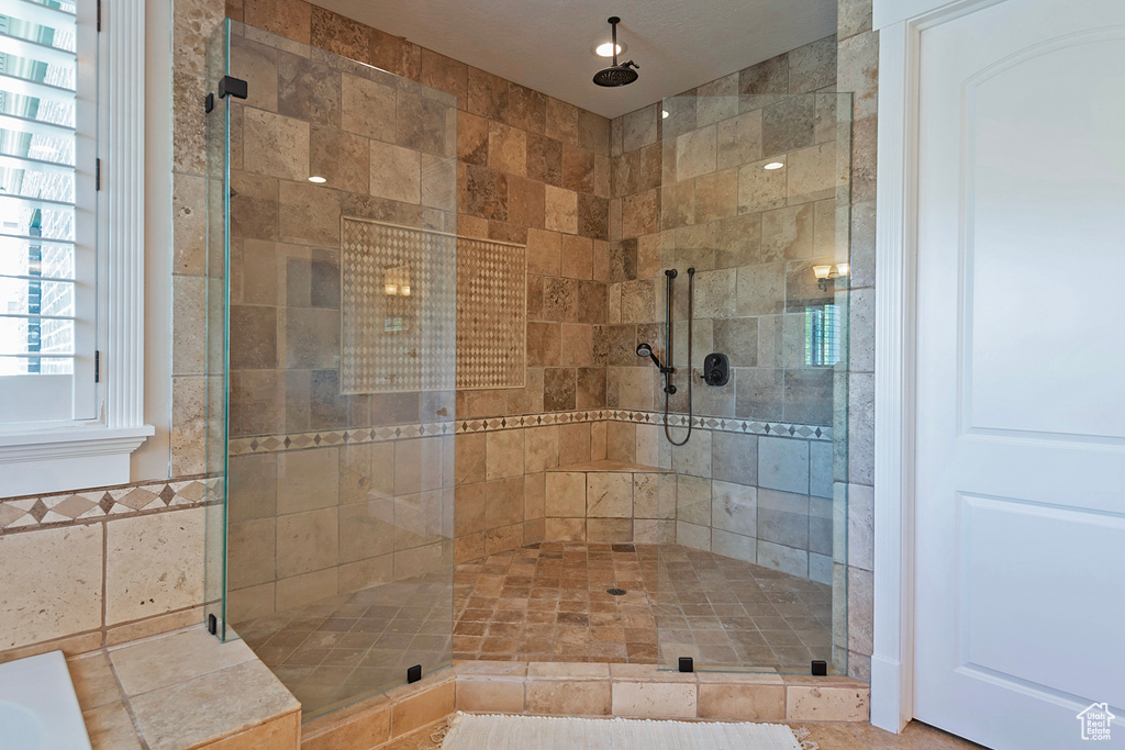 Full bath with a shower stall