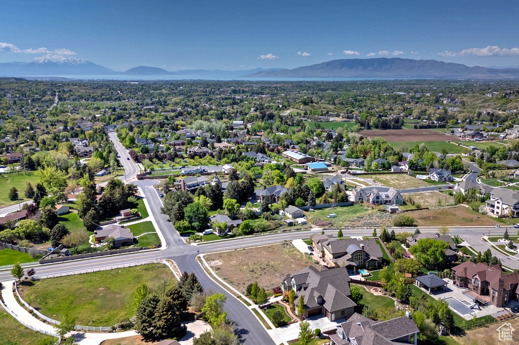 Aerial perspective of suburban area with a mountainous background