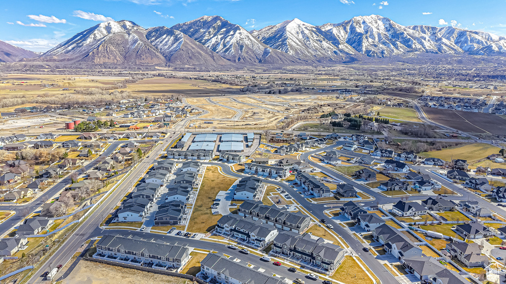 Birds eye view of property with a residential view and a mountain view