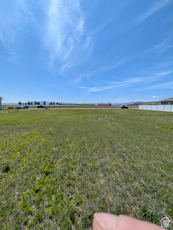 View of green lawn featuring a view of countryside