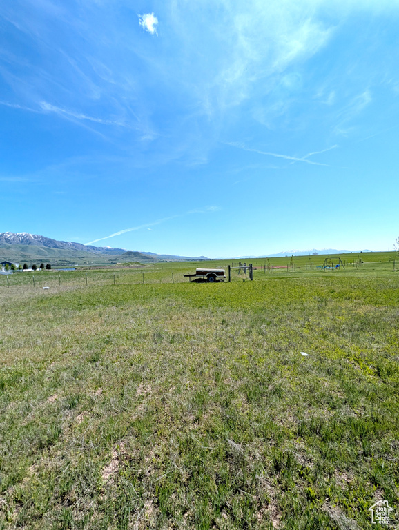 View of yard with a view of rural / pastoral area and a mountain view
