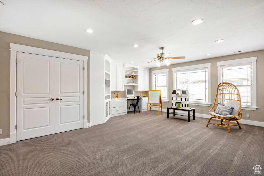 Sitting room with carpet flooring, baseboards, a ceiling fan, and recessed lighting