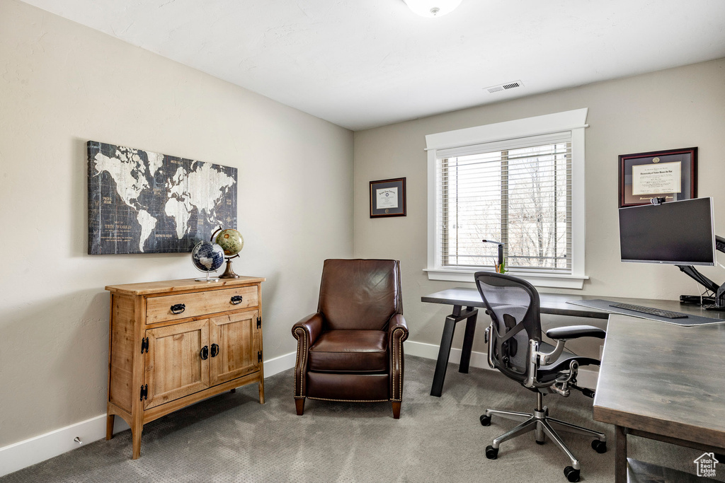 Carpeted office featuring baseboards