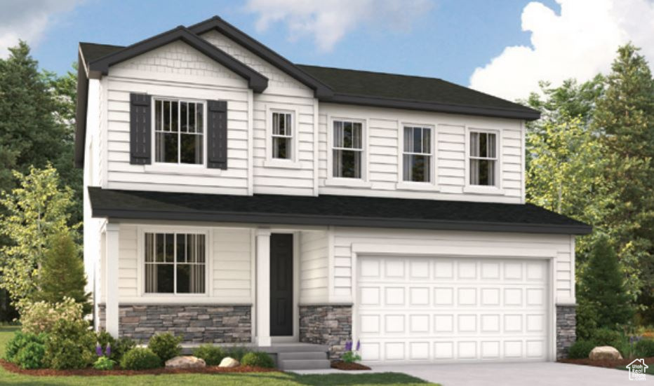 Craftsman-style house with an attached garage, stone siding, and driveway
