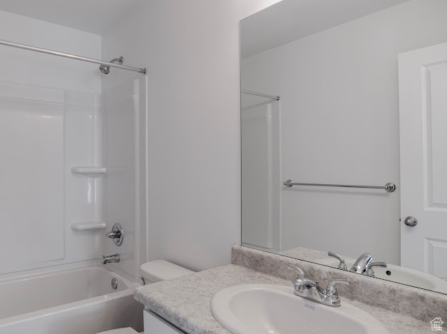 Full bath featuring vanity, toilet, and tub / shower combination