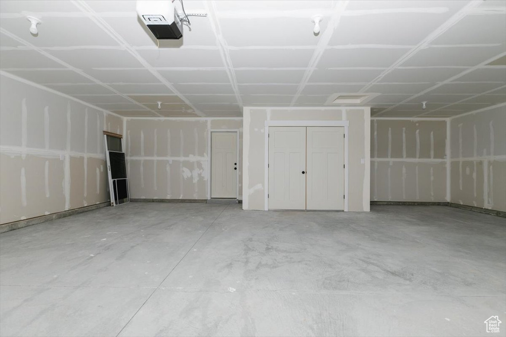 Garage featuring a garage door opener