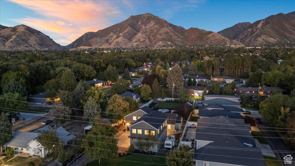 Aerial view at dusk featuring a mountain view