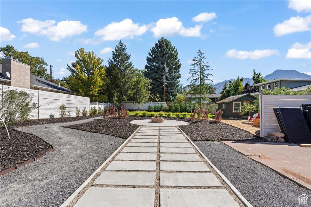 View of yard with a patio, a fire pit, and a fenced backyard