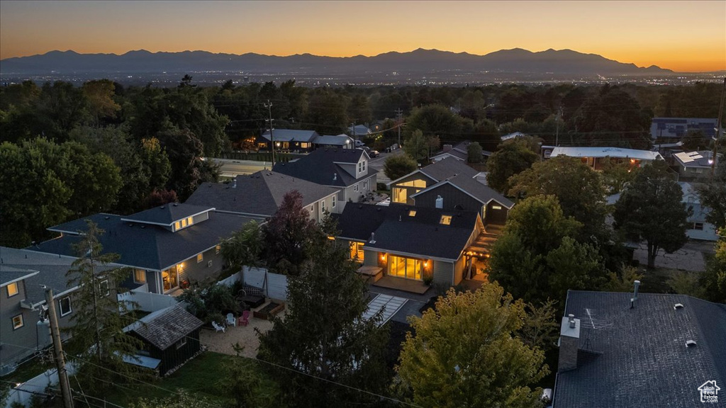 Aerial view at dusk featuring a residential view and a mountain view
