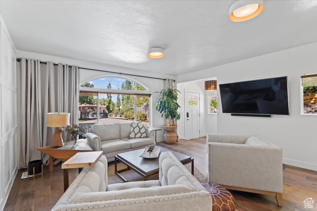 Living area featuring baseboards and wood finished floors