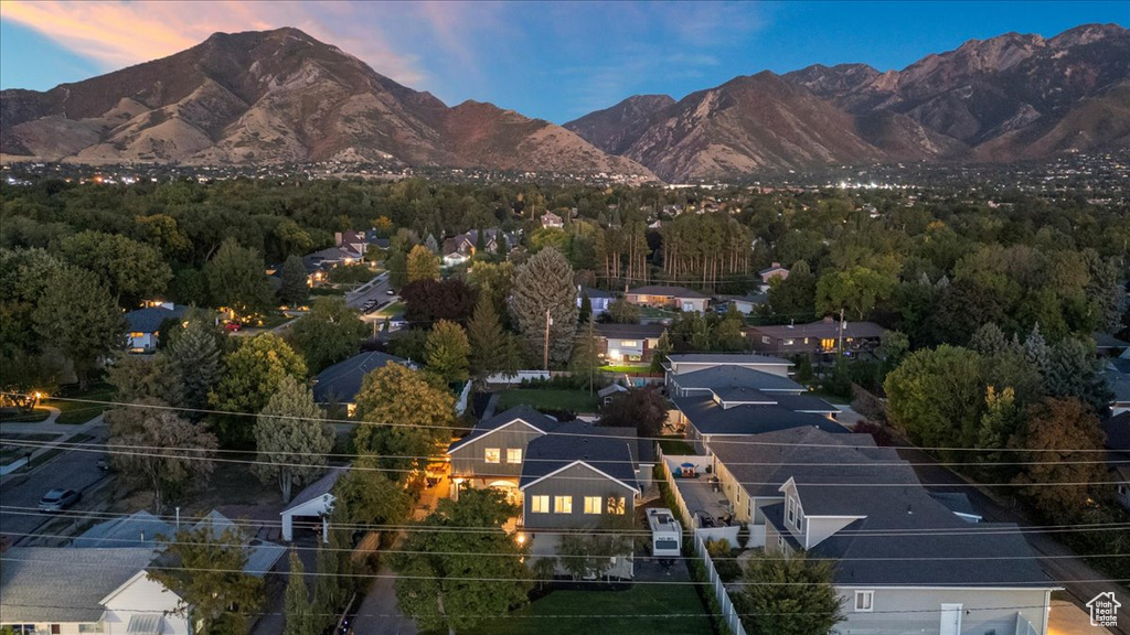 Birds eye view of property with a mountain view