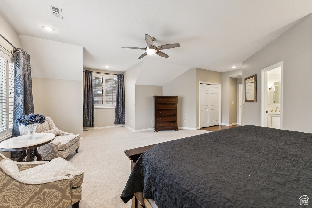 Carpeted bedroom featuring baseboards, visible vents, recessed lighting, ceiling fan, and connected bathroom