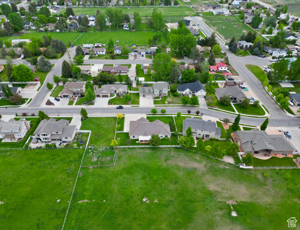 Aerial overview of property's location with nearby suburban area