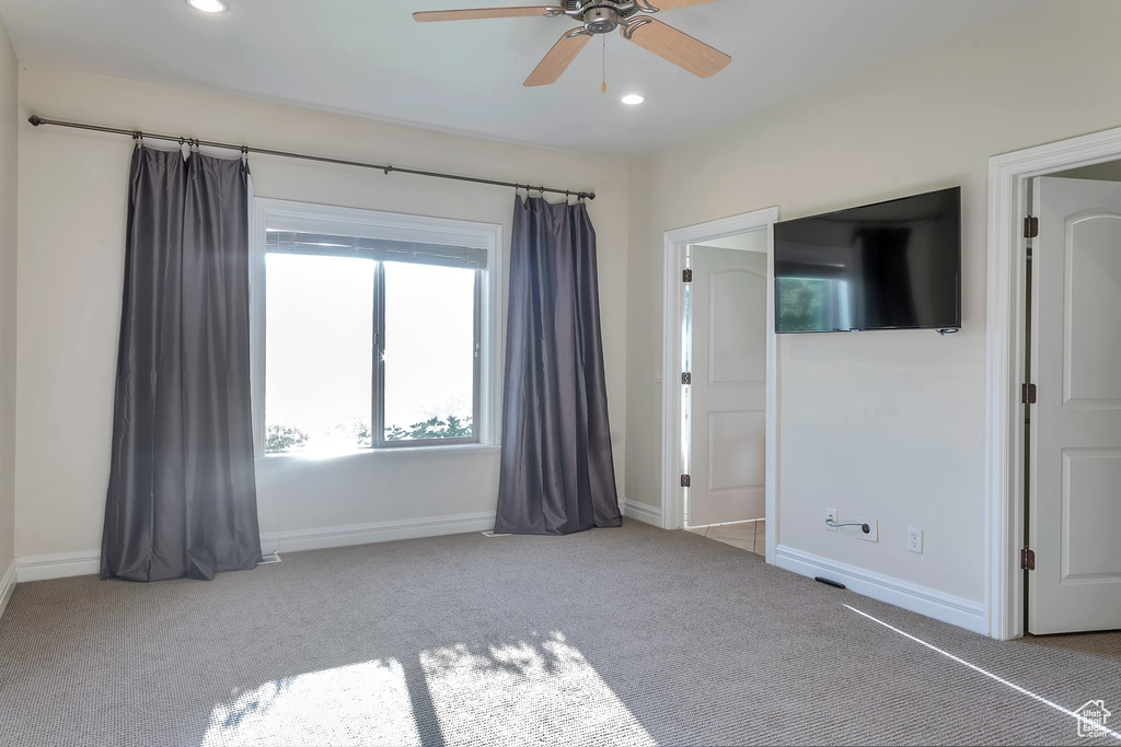 Unfurnished bedroom with carpet floors, recessed lighting, baseboards, and ceiling fan
