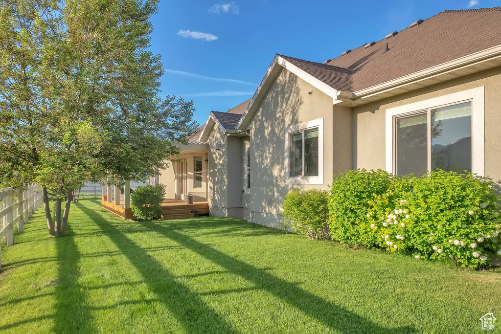 View of yard with a wooden deck