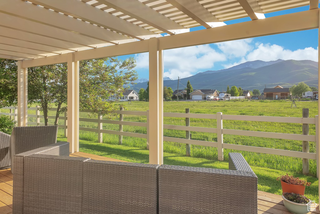 View of patio with a mountain view and a pergola