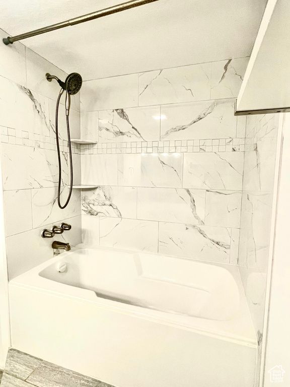 Full bath featuring shower / tub combination