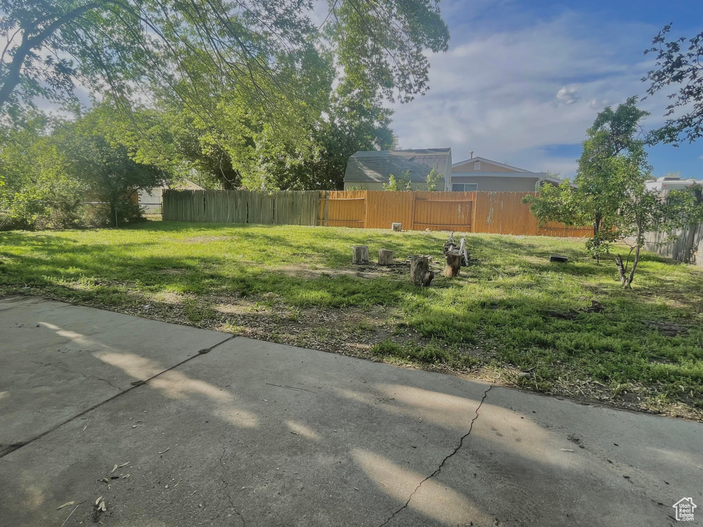 View of yard featuring fence