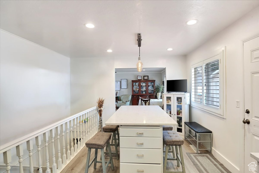 Dining space featuring light wood-style flooring, recessed lighting, and baseboards