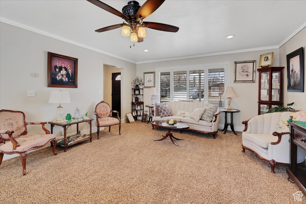 Carpeted living room featuring recessed lighting, baseboards, ceiling fan, and crown molding