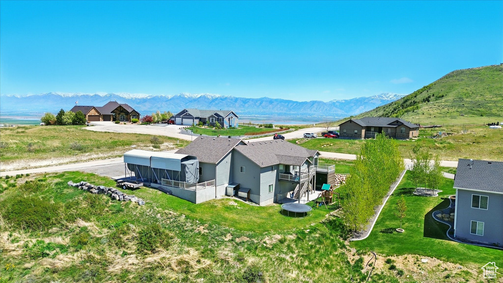 View of subject property with a mountain backdrop