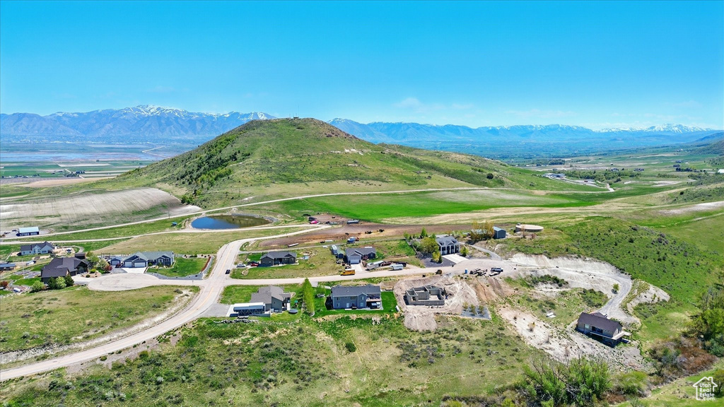 Aerial overview of property's location with a water and mountain view