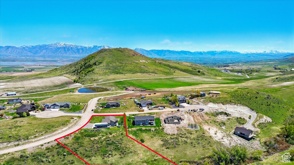 Aerial view of property's location featuring property boundaries highlighted and a water and mountain view
