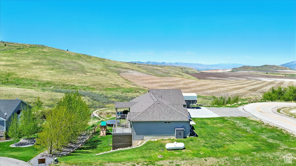 View of subject property with a mountainous background