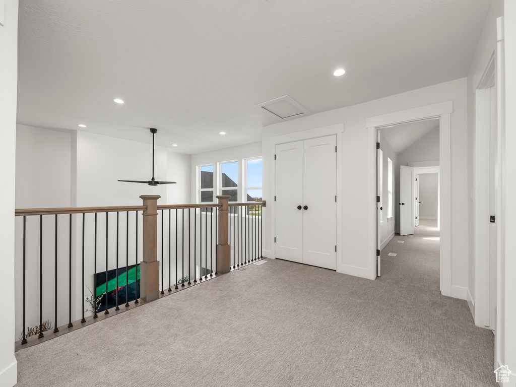 Corridor featuring attic access, recessed lighting, baseboards, and carpet