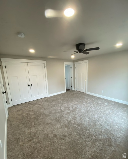 Unfurnished bedroom with baseboards, carpet, and recessed lighting