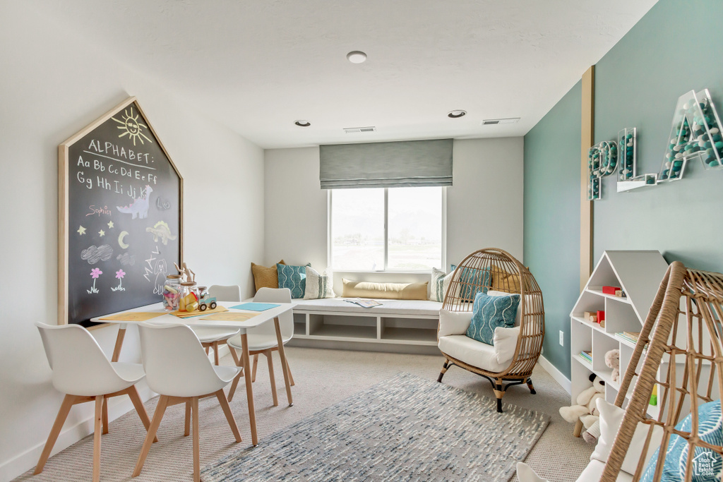 Dining area featuring visible vents, baseboards, and carpet flooring