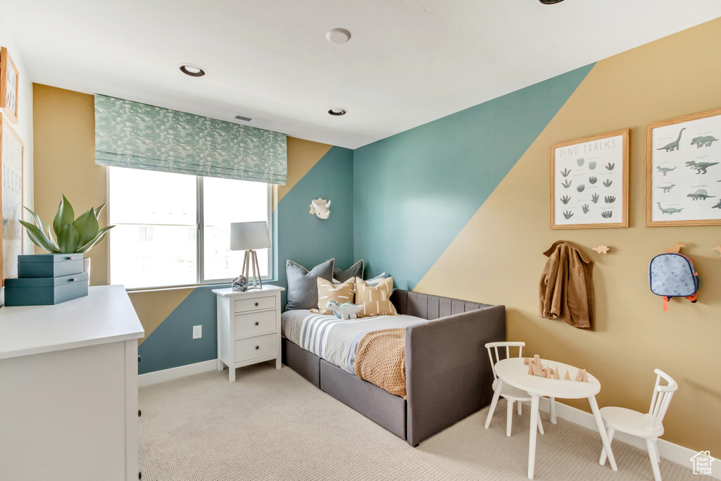 Bedroom with baseboards and carpet floors