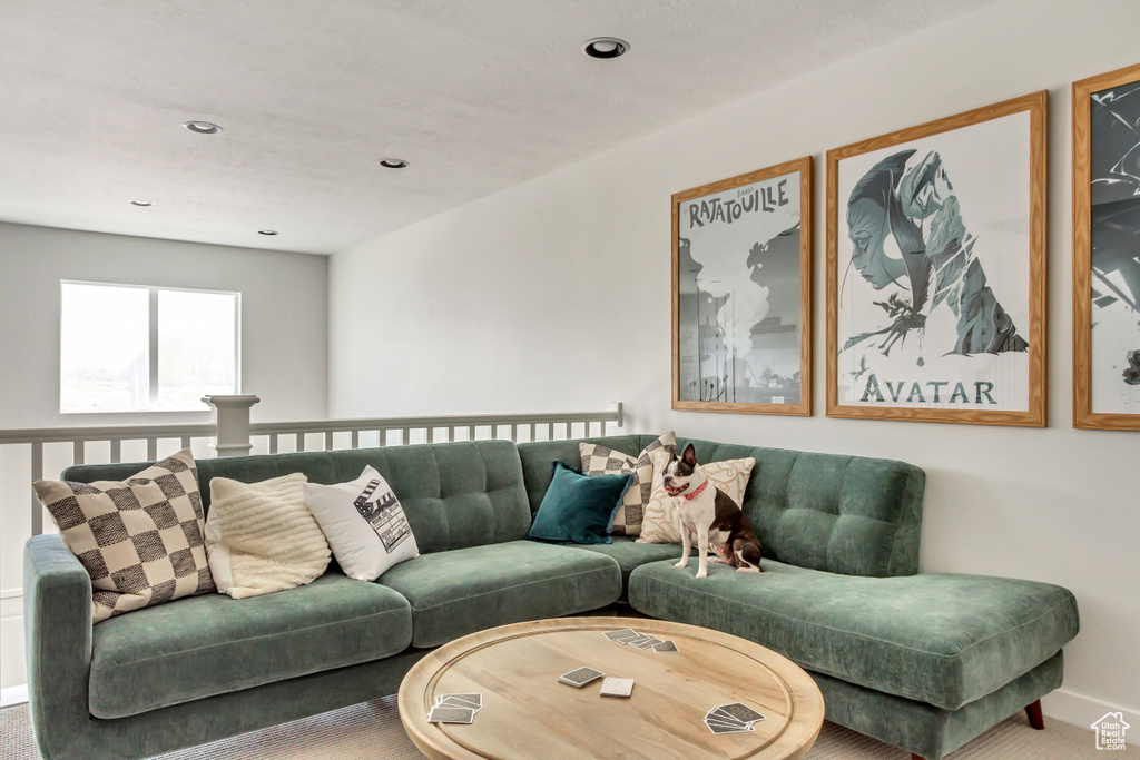 Living room featuring recessed lighting, baseboards, and carpet