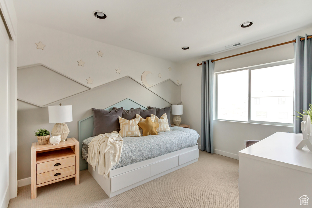 Bedroom featuring recessed lighting, visible vents, light colored carpet, and baseboards