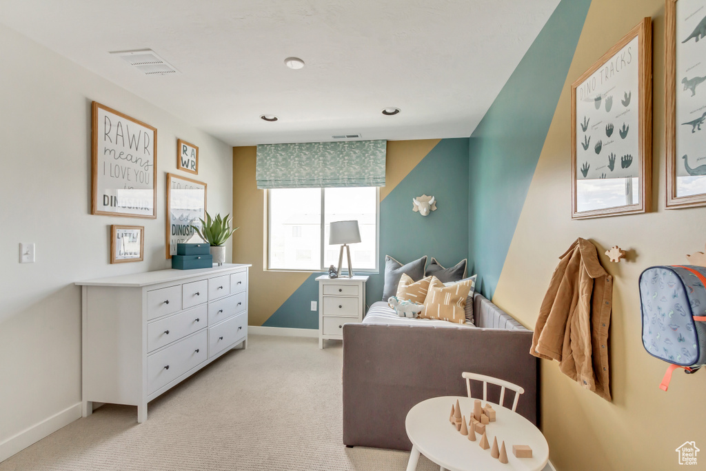 Bedroom with visible vents, baseboards, and light colored carpet