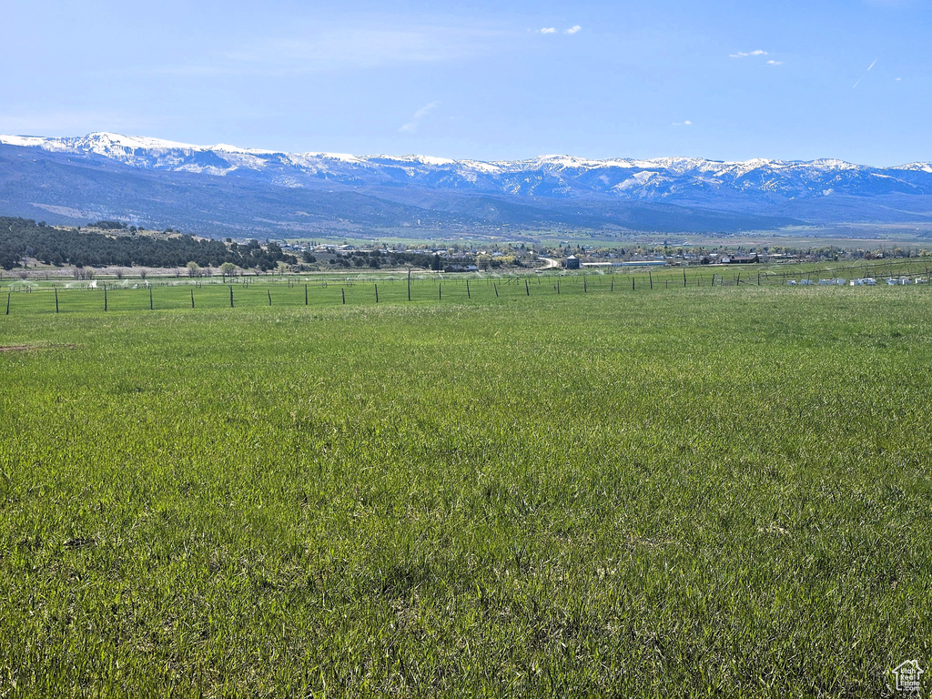 View of mountain backdrop featuring rural landscape