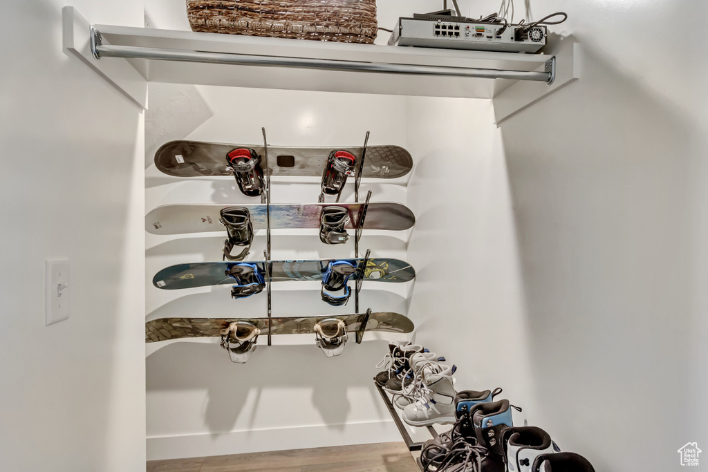 Wine cellar featuring wood finished floors