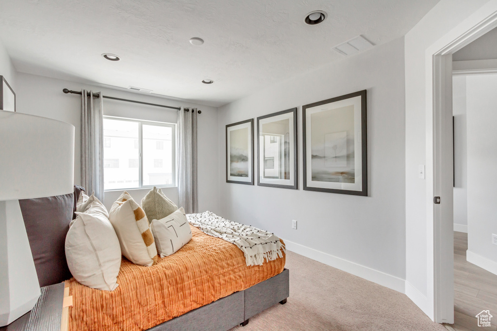 Bedroom featuring visible vents, recessed lighting, carpet, and baseboards