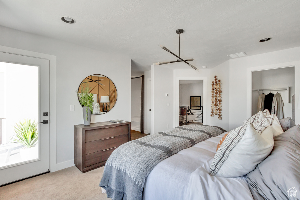 Bedroom with light colored carpet