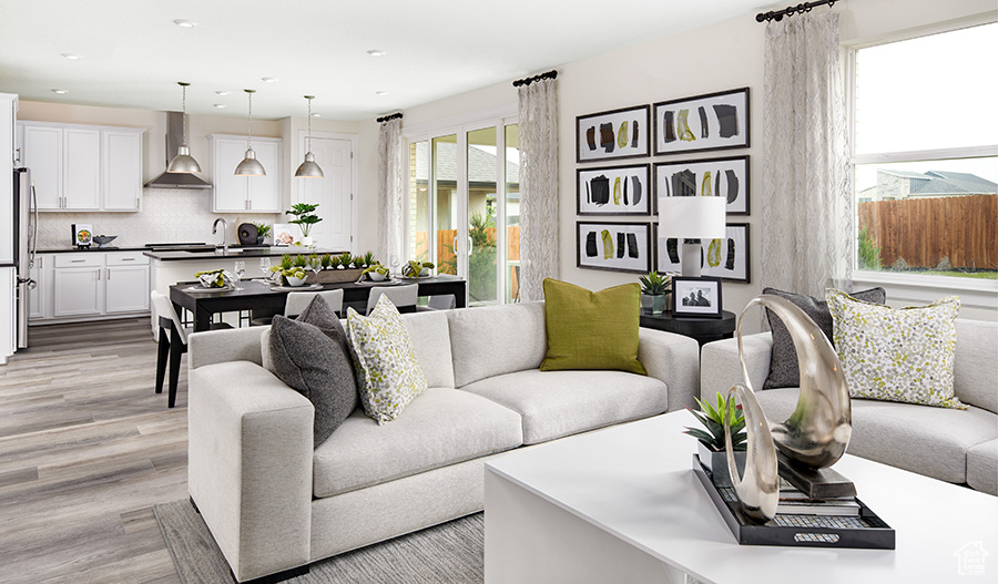 Living area featuring recessed lighting and light wood-type flooring