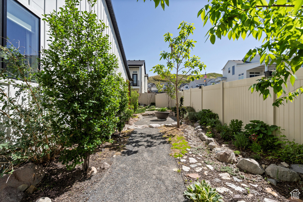 Fenced backyard with a residential view