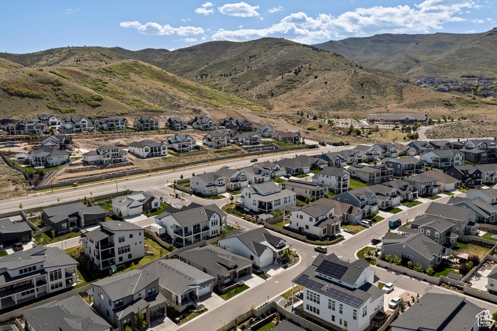 Aerial perspective of suburban area featuring a mountainous background