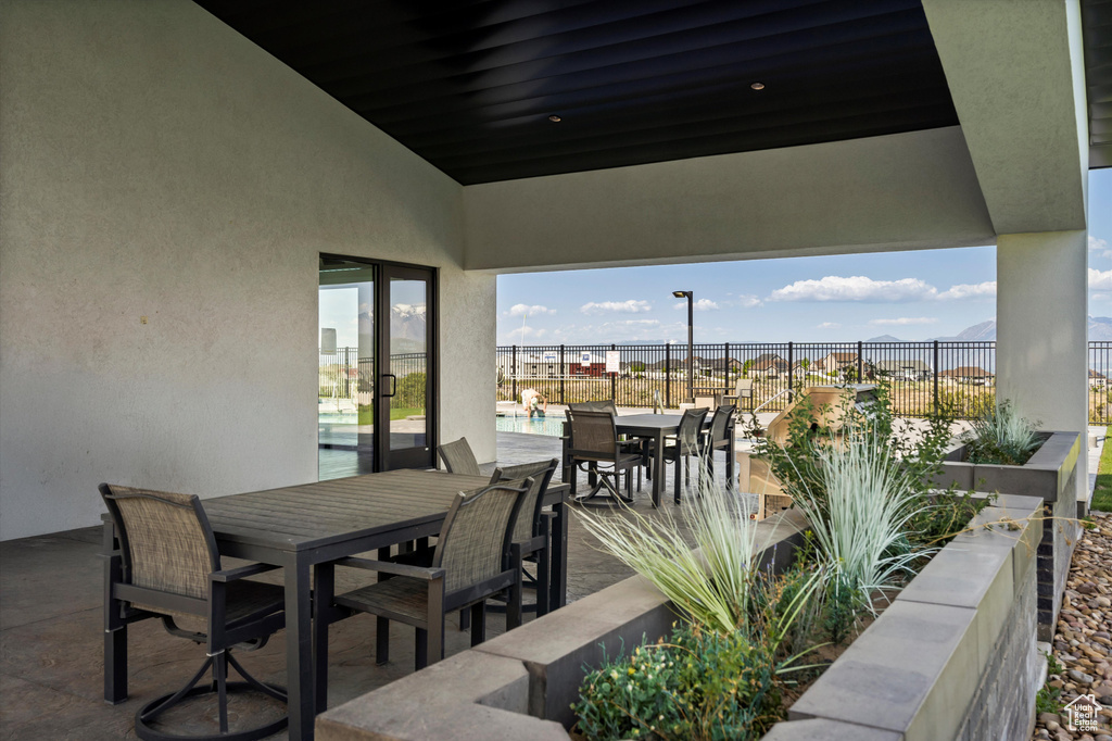 View of patio / terrace with outdoor dining area and fence