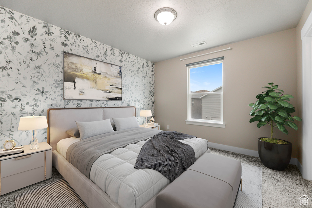Carpeted bedroom featuring wallpapered walls and baseboards
