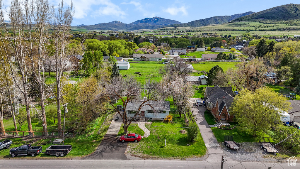 Birds eye view of property with a residential view and a mountain view