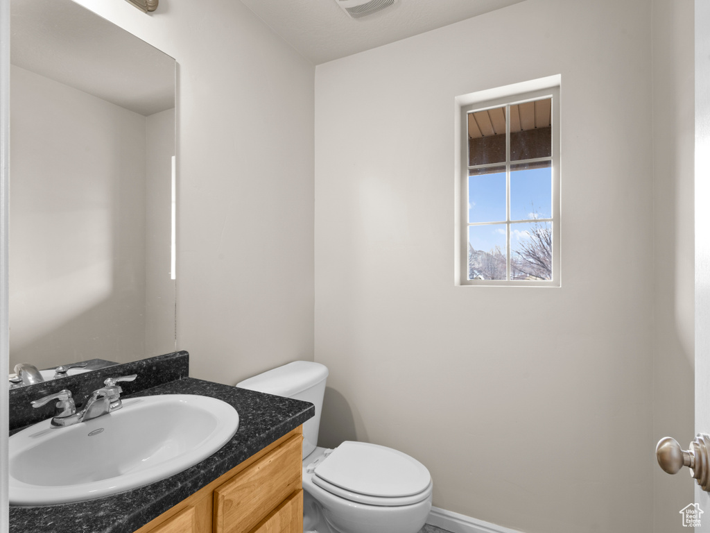 Bathroom with toilet and vanity