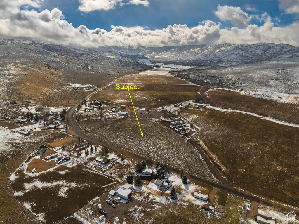 Birds eye view of property featuring a mountain view