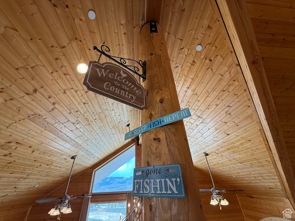 Detailed view of wood ceiling, ceiling fan, and wood walls