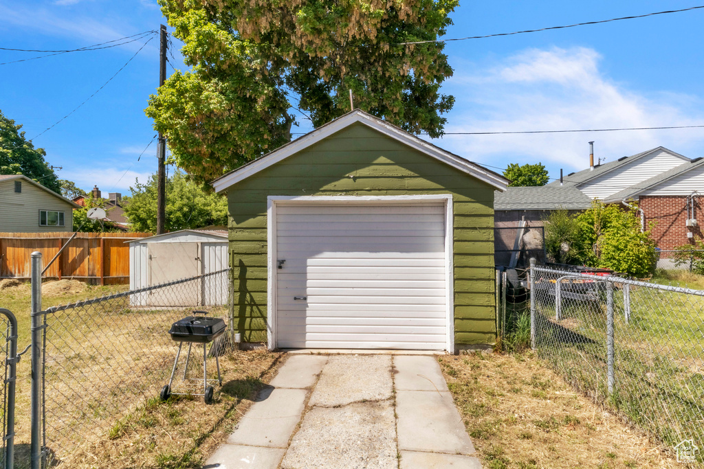 Detached garage with concrete driveway