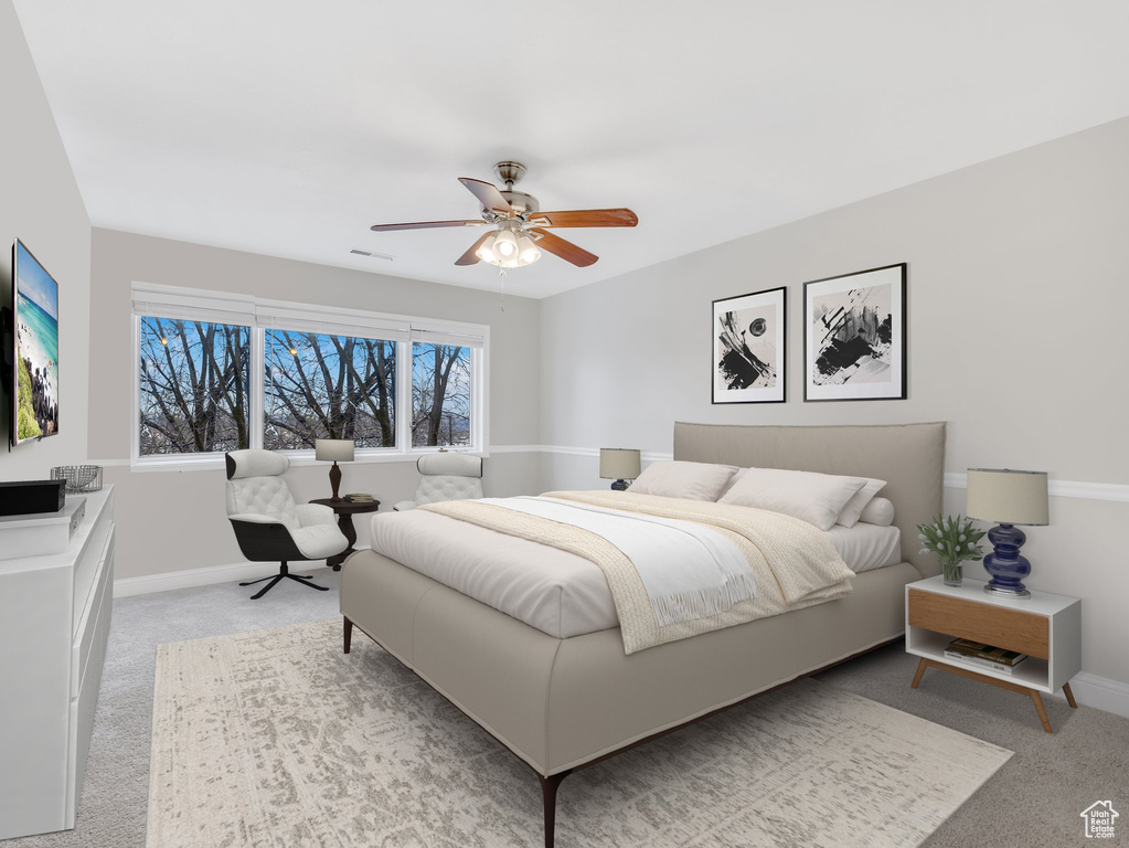 Bedroom featuring visible vents, light carpet, baseboards, and a ceiling fan